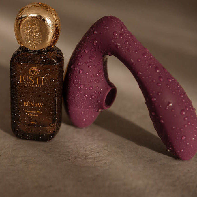 Brown bottle with gold cap and pReclaim Dual Tool t on a gray background